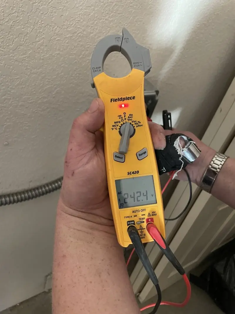 Voltage testing with clamp meter during Electrical Installation Services in Richlands